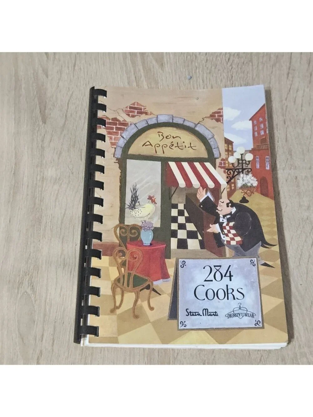284 Cooks Steinmart/ Dignity U Wear Spiral Bound Cookbook 2005